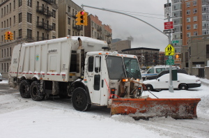 NY Sanitation department garbage truck equipped with snow plow. (Image by Jospeh A - Flickr)