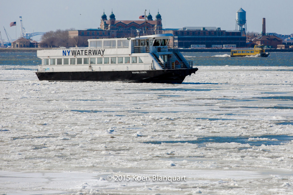 The NY Waterway ferry continues its original route towards Manhattan, after it assisted the Liberty Landing Ferry Service Ferry to get out of the ice